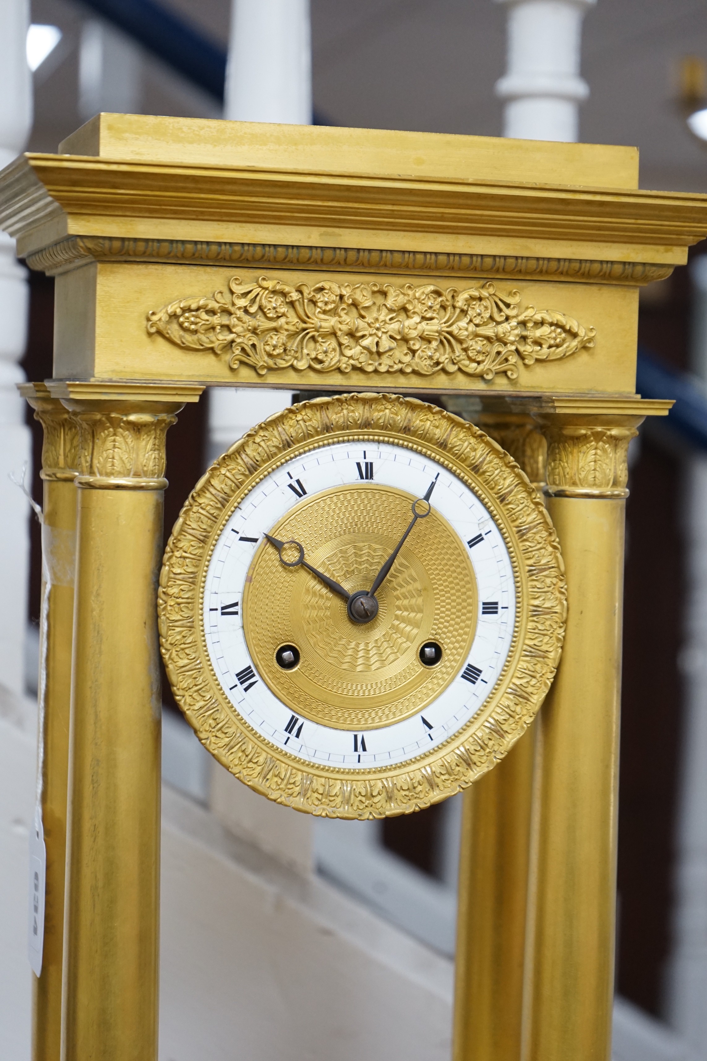 A large mid 19th century French ormolu portico clock. 49cm tall
